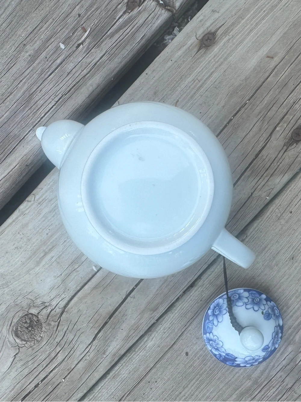 Blue and white floral teapot with butterfly design
